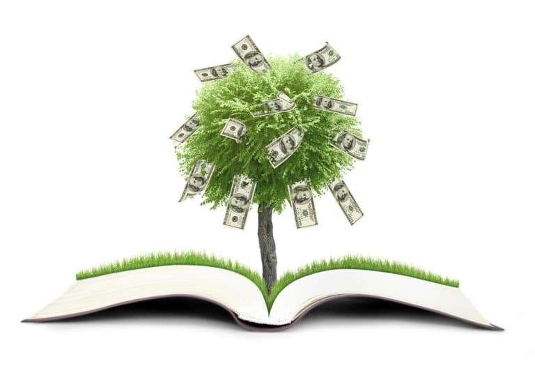 Tree growing from book and sprouting money. Make smart financial decisions with 7 principles of prosperity