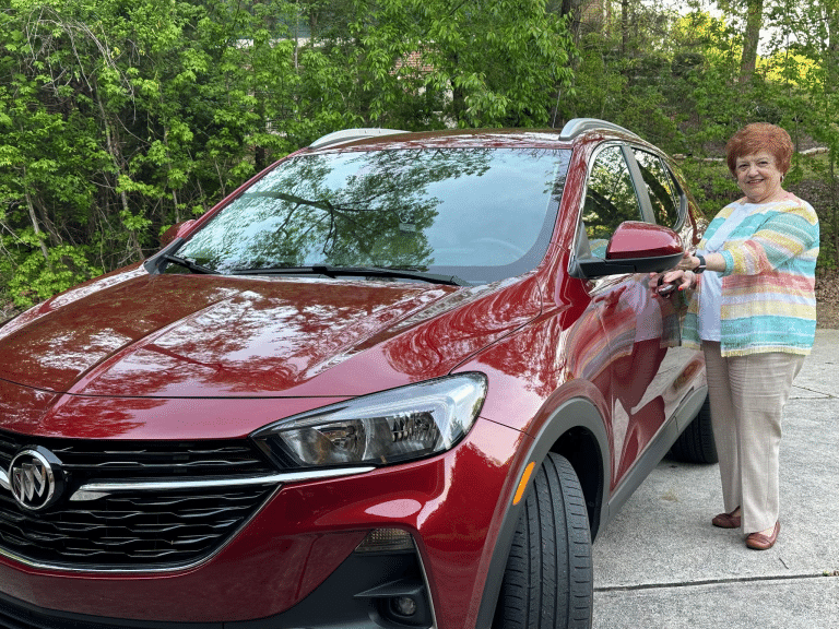 Art's wife with their new car, car buying strategy